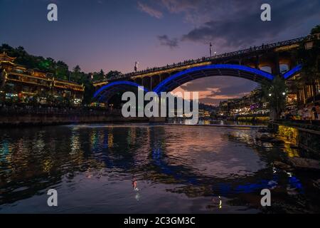 Road bridge over Tuo Jiang river in Feng Huang Stock Photo