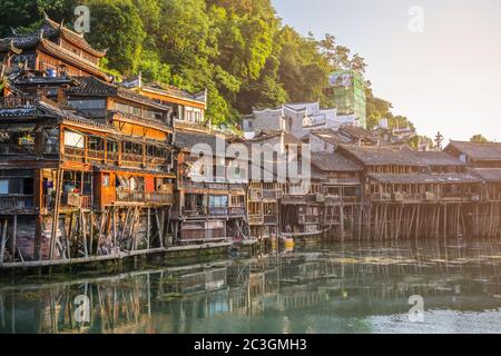 Old historic wooden Diaojiao houses in Fenghuang Stock Photo