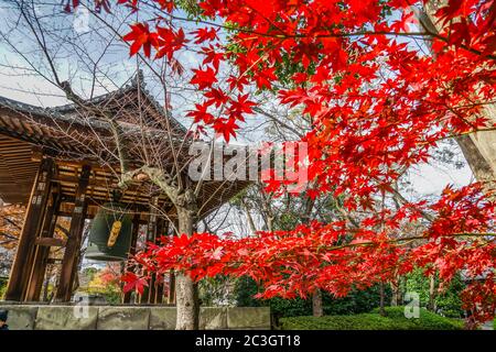 Bell of New Year s Eve and autumn leaves Stock Photo