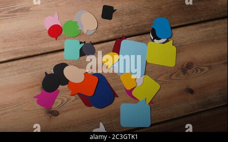 Papercuts of text boxes on a wooden table Stock Photo