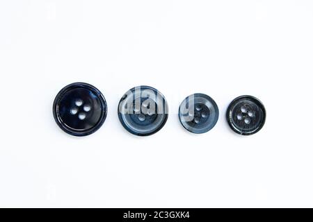 black buttons for clothes on white background Stock Photo