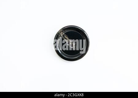 black buttons for clothes on white background Stock Photo