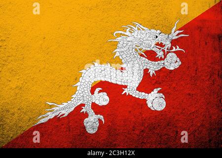 Kingdom of Bhutan National flag with Druk. Grunge background Stock Photo