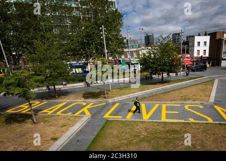 The words 'Black Lives Matter' painted in yellow, covering the length of the walkway from Thomas Street to General Gordon Place in the centre of Woolwich, south London. Stock Photo