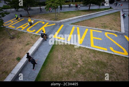 The words 'Black Lives Matter' painted in yellow, covering the length of the walkway from Thomas Street to General Gordon Place in the centre of Woolwich, south London. Stock Photo