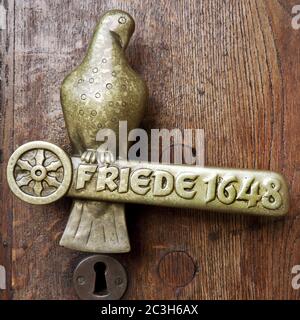 Door handle with lettering peace 1648, Westfaelischer Friede, town hal, Osnabrueck, Germany Stock Photo
