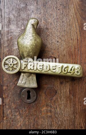 Door handle with lettering peace 1648, Westfaelischer Friede, town hal, Osnabrueck, Germany Stock Photo