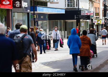 Ashford, Kent, UK. 20 June, 2020. Following the announcement by the government that non essential shops can open, the Ashford town centre high street appears busier than it has in the past few months of the Coronavirus pandemic during the first weekend of shops opening. Photo Credit: Paul Lawrenson/Alamy Live News Stock Photo