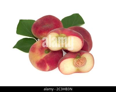 Peaches with leaves isolated on white Stock Photo