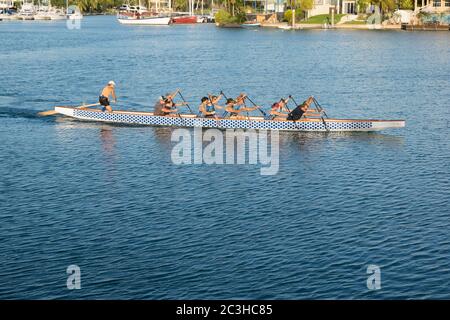 Rowing team working in Darwin's Cullen Bay Marina in Darwin, Northern Territory, Australia Stock Photo