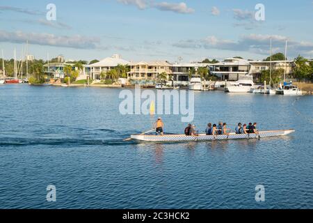 Rowing team working in Darwin's Cullen Bay Marina in Darwin, Northern Territory, Australia Stock Photo