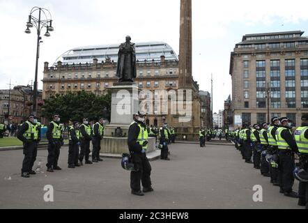 Police in George Square in Glasgow city centre for a Glasgow Says No to Racism event aimed at 'sending a positive anti-racist message from Glasgow's George Square to the world on World Refugee Day'.