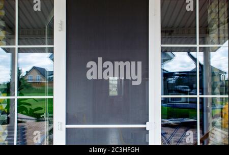 plastic door with mosquito net outdoor with daylight Stock Photo