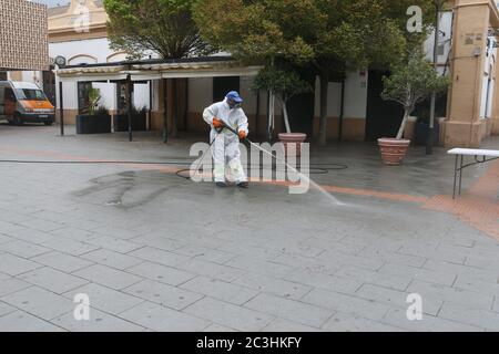 A cleaning worker disinfect the streets with blea as a quarantine is set after the coronavirus (COVID-19) outbreak in the touristic Mallorca  island Stock Photo