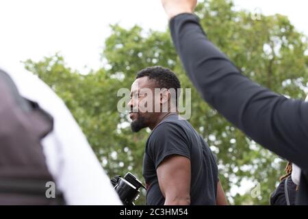London, UK. 20th June, 2020. BLM Protestors give speeches at Parliament Square. Protests have been taking place across the UK for several weeks now in support of the Black Lives Matter movement. Credit: Liam Asman/Alamy Live News Stock Photo