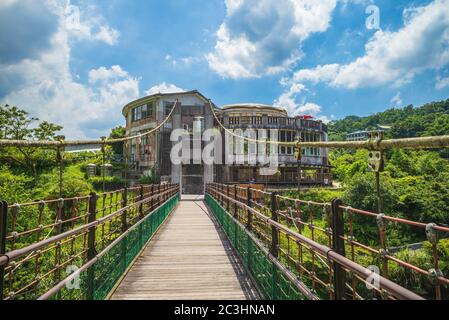 ruin at the end of a suspension bridge in new taipei, taiwan Stock Photo