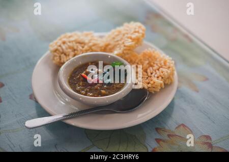 Crispy rice cake and pork and shrimp dipping. traditional  Thai snack food appetizer Stock Photo