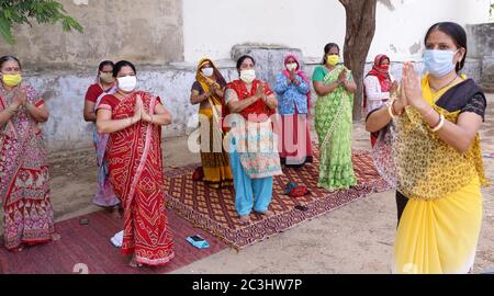 Beawar, India. 20th June, 2020. Anganwadi workers practice 'Surya Namaskar' yoga on the eve of International Yoga Day, during the ongoing COVID-19 lockdown in Beawar. Yoga is a physical, mental and spiritual practice which originated in India. (Photo by Sumit Saraswat/Pacific Press) Credit: Pacific Press Agency/Alamy Live News Stock Photo