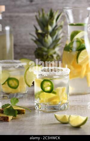 Spicy Margarita. Tequila Infused on Slices of Fresh Pineapple, Lime,  hot jalapeno Stock Photo