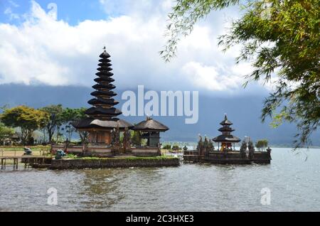Pura Ulun Danu Beratan is located on shores of lake Beratan in Bali, Indonesia. Believed to be built in 1663, it is a major Hindu Shivaite temple. Stock Photo