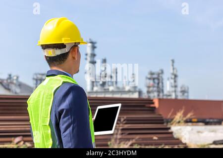 Construction Worker Planning Contractor Checking  at site gas, oil, energy and factory construction. Stock Photo