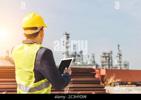 Construction Worker Planning Contractor Checking  at site gas, oil, energy and factory construction. Stock Photo
