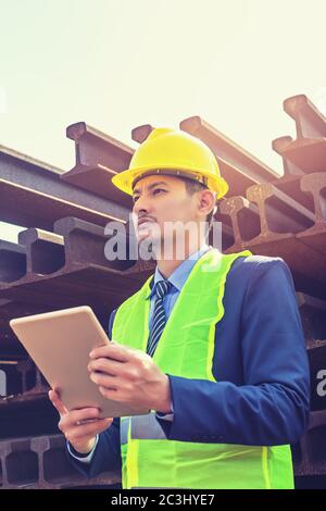 Construction Worker Planning Contractor Checking  at site gas, oil, energy and factory construction. Stock Photo