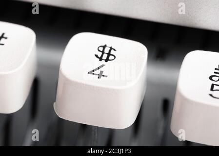 An extreme close-up or a macro shot of a plastic keyboard key from a manual typewriter with a shallow depth of field and selective focus. Stock Photo
