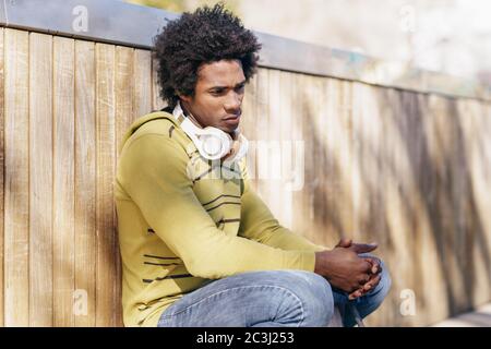 Traveling man worried about the current circumstances in the world. Stock Photo