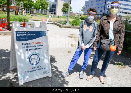 Mother and son (model released) getting ready to get tested in a Covid-19 mobile clinic in Montreal Canada Stock Photo