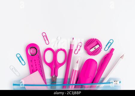 Pink school supplies on white background. Copy space, top view Stock Photo