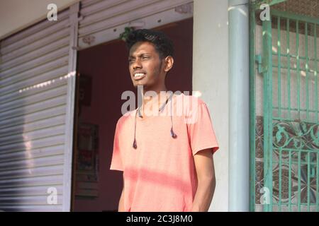 Person On Sunlight Over Background As Portrait Of Metal Shutter Gate Gate Stock Photo Alamy