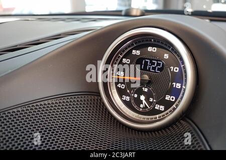 Moscow, Russia - April 23, 2019: Interior details of a sports car Porsche. Sports chronometer with electronic clock on the dashboard. Stock Photo