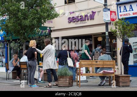 Herne Hill, London, England. 20th June 2020. A busy Saturday afternoon as non-essential businesses reopen on Railton Road next to Herne Hill Station in South London following the British government relaxing coronavirus lockdown laws significantly from Monday June 15. (photo by Sam Mellish / Alamy Live News Stock Photo