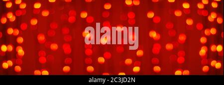 red garland lights background, blurry bokeh backdrop for web banner Stock Photo