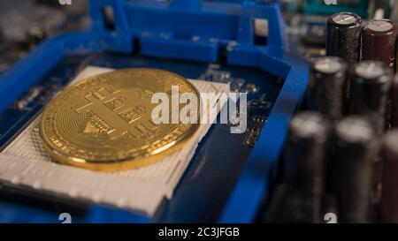 Bitcoin on the motherboard. Crypto currency Gold Bitcoin - BTC - Bit Coin Stock Photo