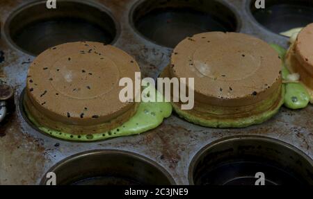 Chocolate chip mousse cake with chocolate mint ice cream in a muffin pan Stock Photo