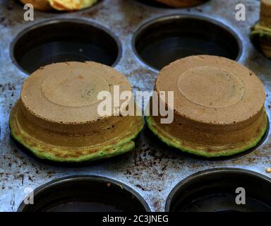 Chocolate chip mousse cake with chocolate mint ice cream in a muffin pan Stock Photo