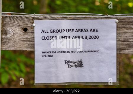 Closure sign for group use areas in park due to Covid-19 pandemic Stock Photo