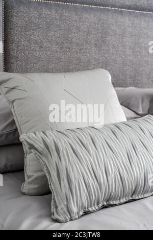Decorative pillows on a bed Stock Photo