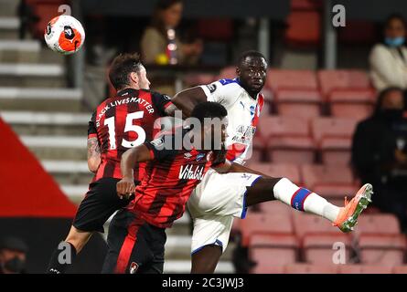 Crystal Palace's Cheikhou Kouyate (right) battles for the ball with Bournemouth's Adam Smith (left) and Jefferson Lerma during the Premier League match at the Vitality Stadium, Bournemouth. Stock Photo