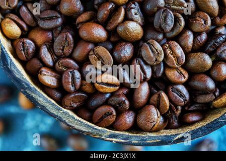 coffee beans in coconut plates. Close-up. Top view Stock Photo