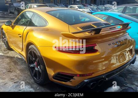 Moscow, Russia - May 09, 2019: Golden Porsche 911 Turbo S Exclusive series. Limited edition. Number three hundred thirty seven. In the world were produced only 500 cars. Back side view Stock Photo