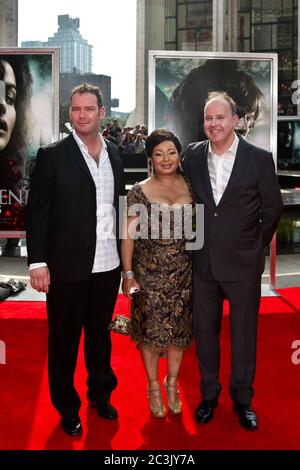 Director David Yates (R) and Yvonne Walcott and guest attend the New York premiere of 'Harry Potter And The Deathly Hallows: Part 2' Stock Photo