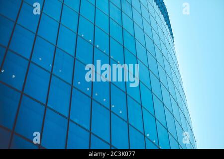 Business class modern glass building against the sky with toned. Stock Photo