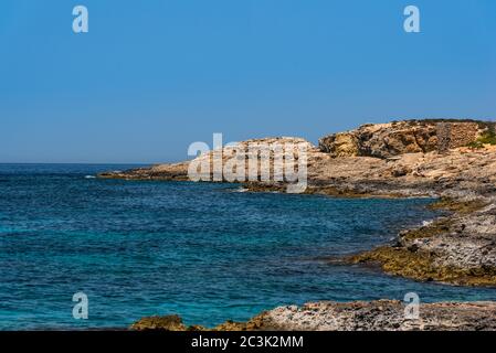 Blue clear sea water on the coast line on Malta Stock Photo