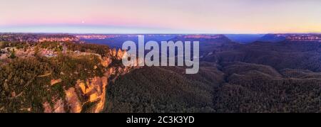 Wide aerial panorama overe BLue Mountains canyon and the Three sisters rock formation near Echo point lookout of Katoomba town. Stock Photo