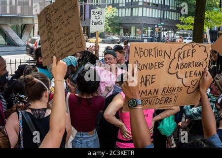 A coalition of pro-choice and civil rights groups protest the event 'Jesus Matters,' organized by two anti-abortion hate groups, Love Life and Operation America, and headlined by far-right minister Flip Benham (pink shirt), who was featured in the documentary 'AKA Jane Roe', in Cooper Triangle in New York City on June 20, 2020. (Photo by Gabriele Holtermann/Sipa USA) Credit: Sipa USA/Alamy Live News Stock Photo