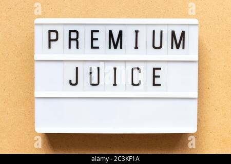 Lightbox with word premium juice on wood background Stock Photo