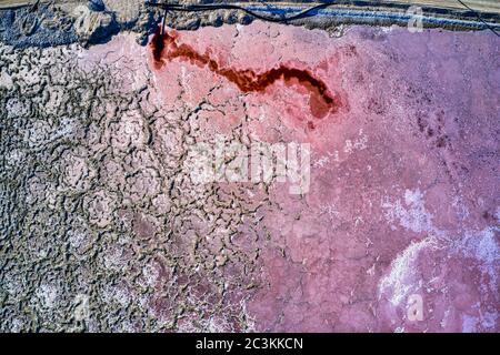 Aerial shot of a red and gray salt lake in Searles, California Stock Photo